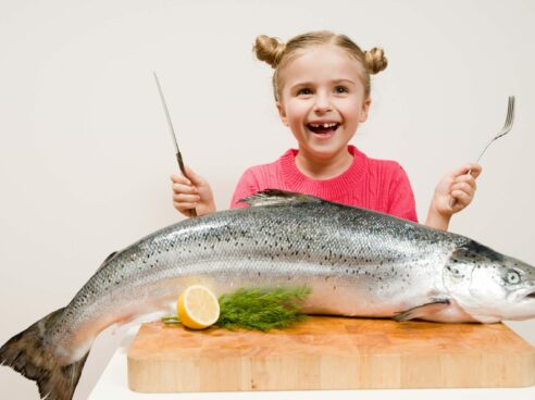 child with large fish